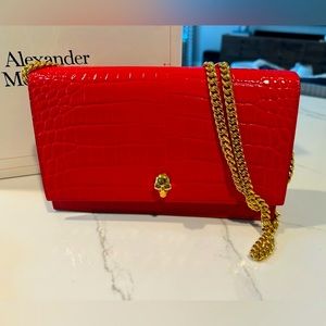 Alexander McQueen small embossed leather crossbody bag